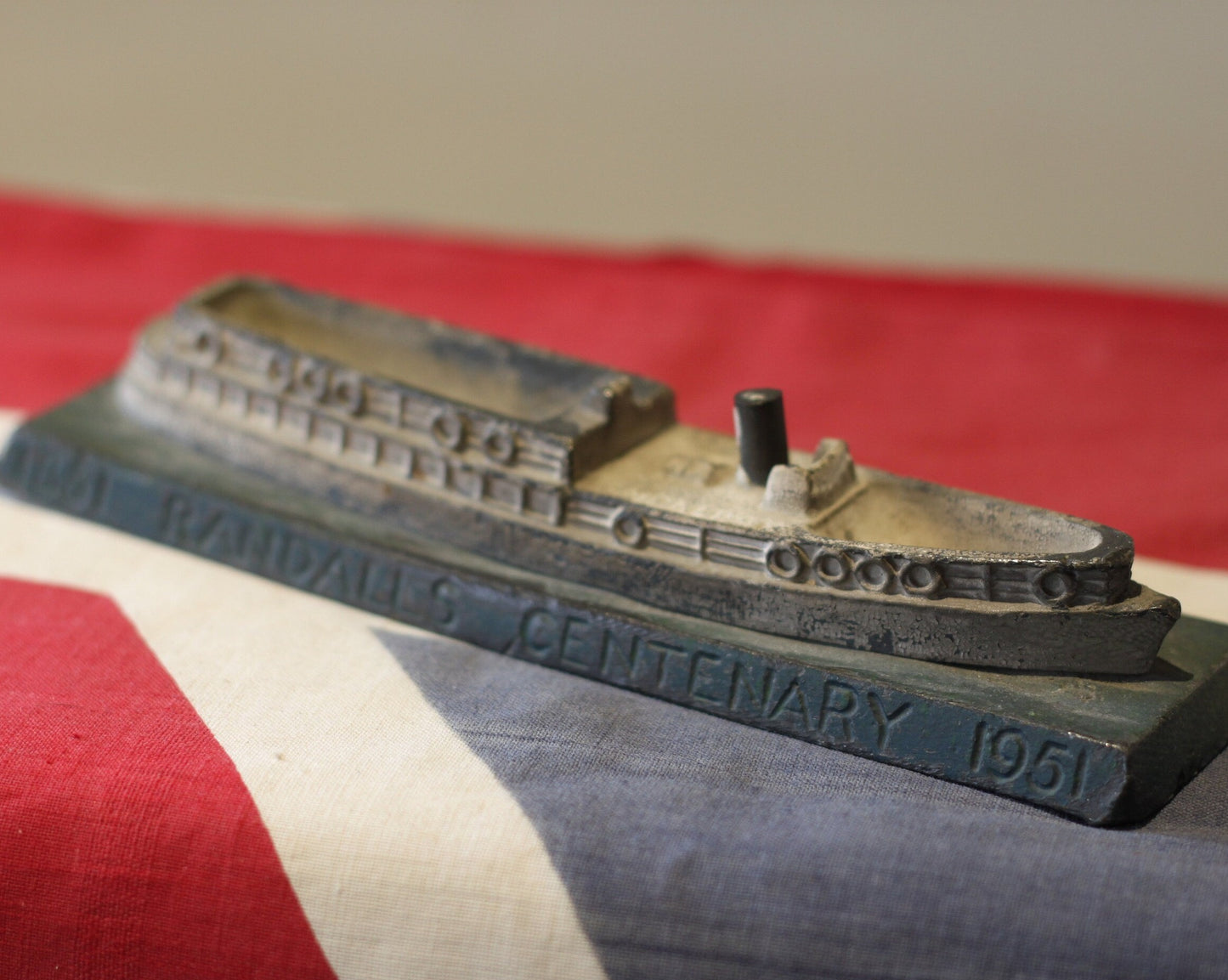 A heavy cast metal Randall's Centenary advertising ship desk paperweight 1851-1951