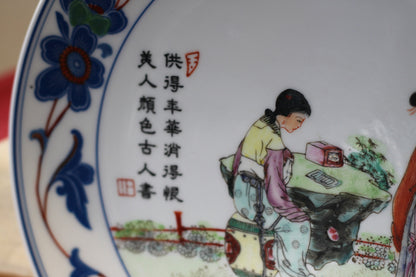 A Chinese porcelain plate with 4 character mark and script 24.5cm dia