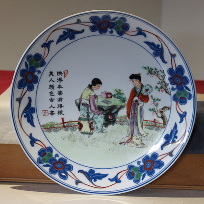 A Chinese porcelain plate with 4 character mark and script 24.5cm dia