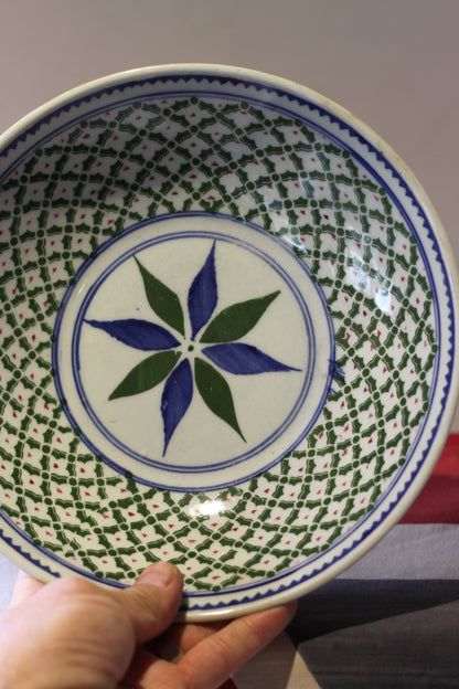 an oriental blue and green decorated shallow bowl with unglazed foot 23cm diameter