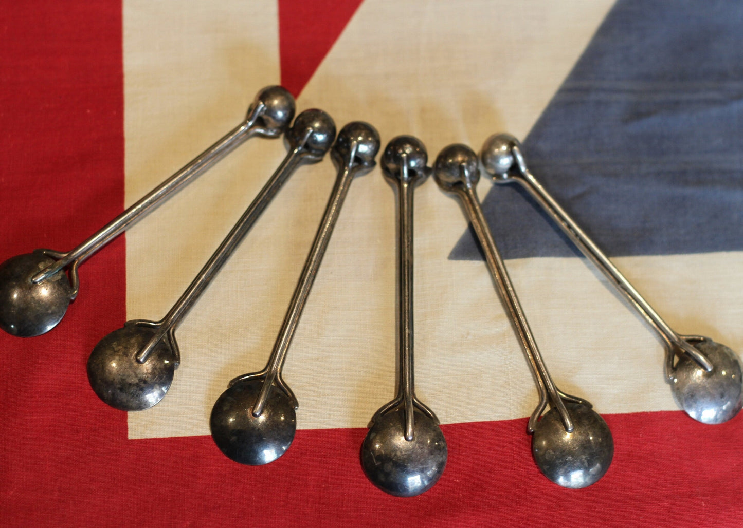 A set of Six Fantastic Arts & Crafts White Metal Spoons With Ball Terminals in the Manner of Christopher Dresser each 12.5cm in Length