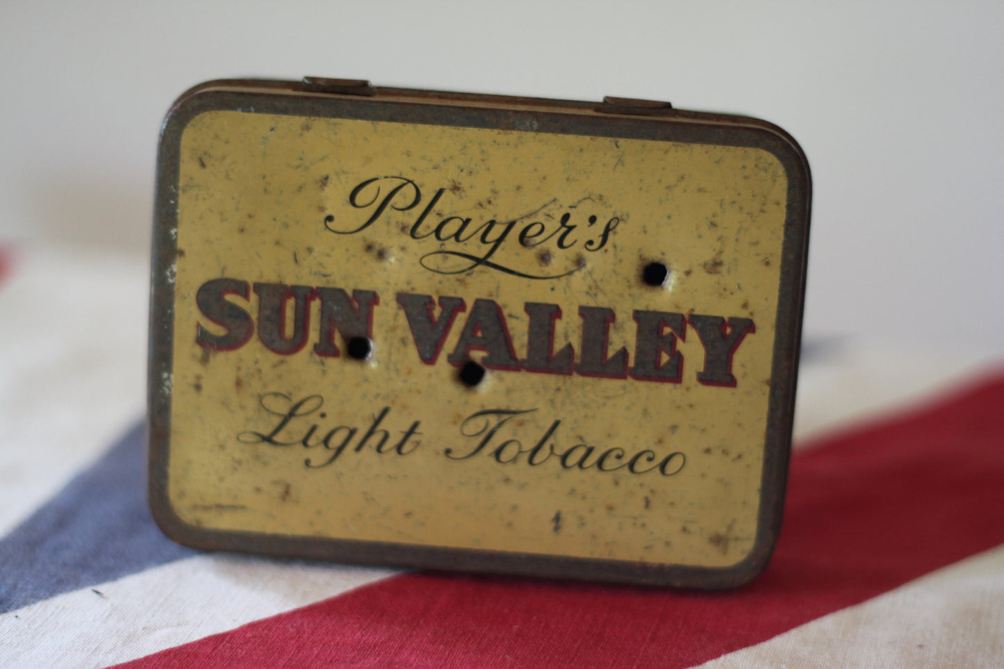 A Vintage Player's Sun Valley Light Tobacco Tin With Possible Bullet Holes 11x8x2cm