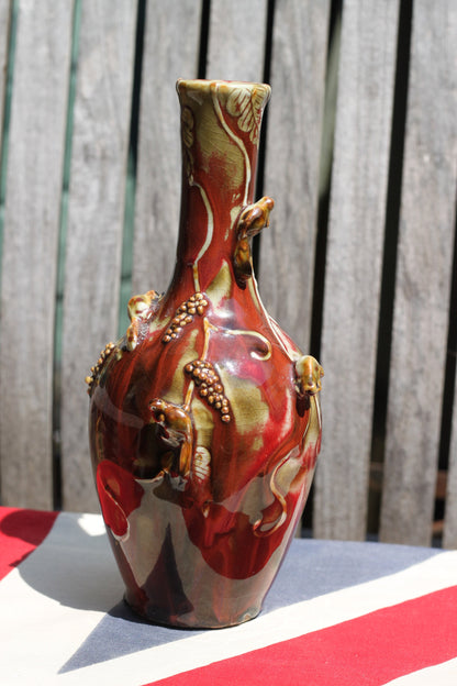 A Chinese Flambe Vase Decorated With Small Creatures Climbing a Vine  22cm Tall