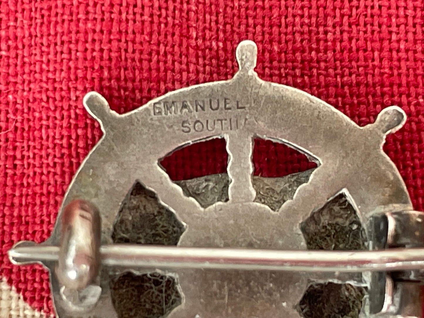 A Solid Silver and Enamel Pin Badge -Union-Castle Shipping Line Ships Wheel Badge Made in Southall,  Birmingham 1909 by Michael Emanuel