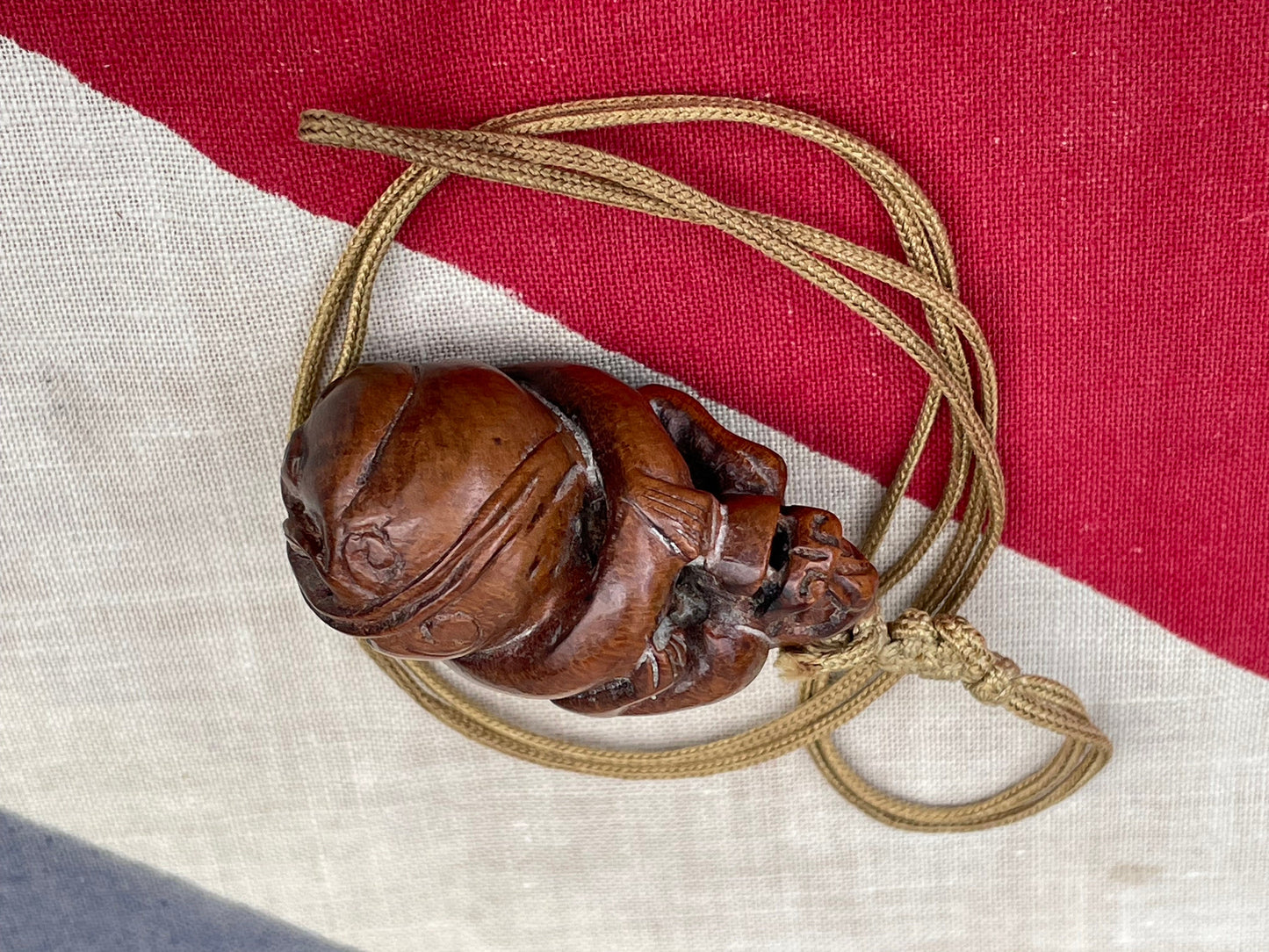 A Hand Carved Wooden Dress Toggle of a Chinese Mythical Beast on a Silk Cord 4.5cm Long