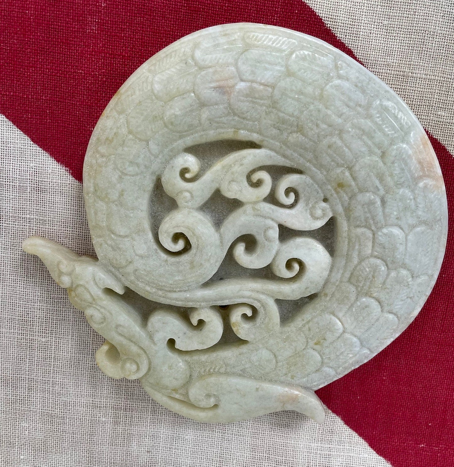 A Chinese Hardstone Disc Carving of a Curled up Dragon 8cm Diameter.