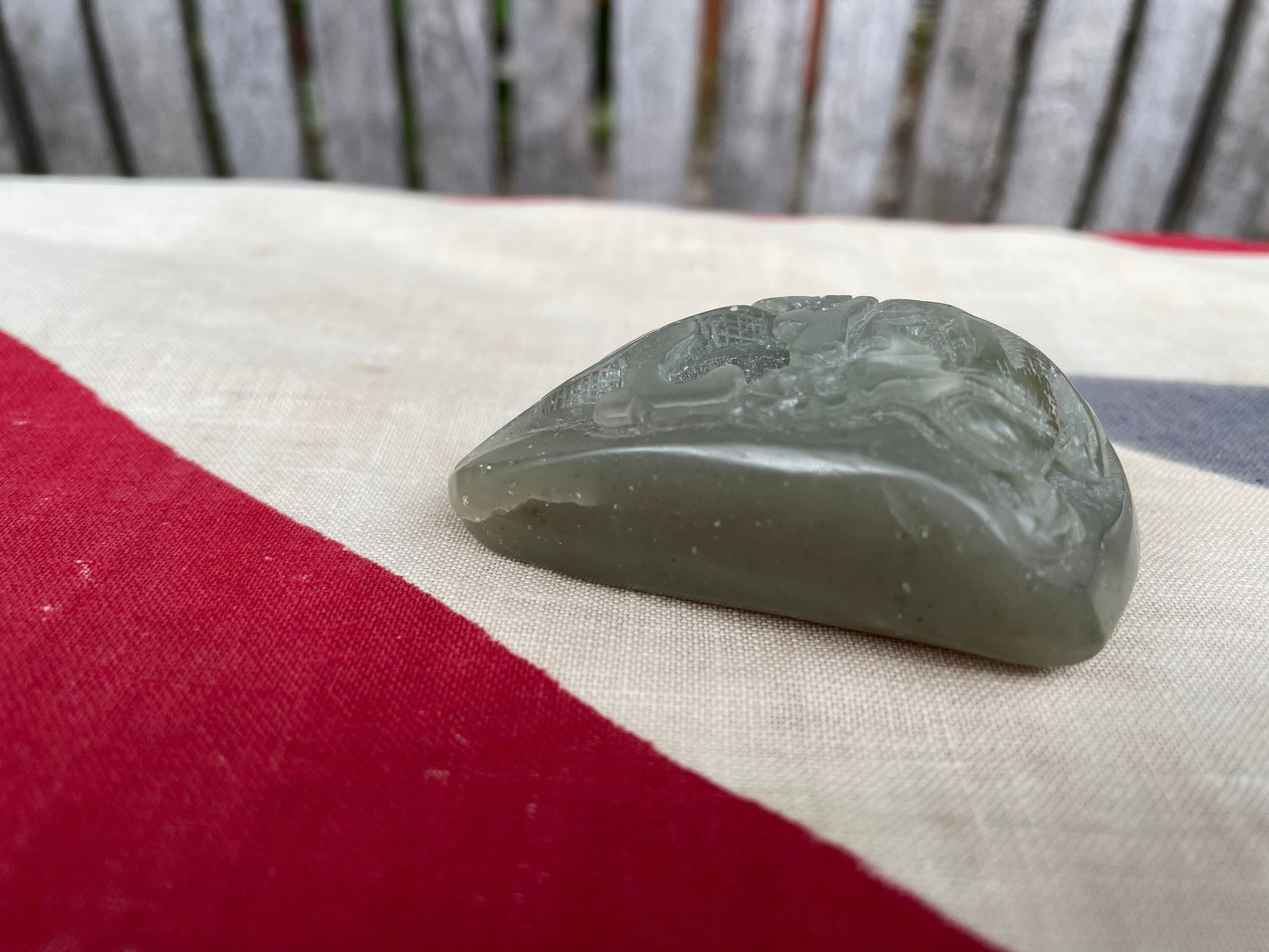 A Chinese Green Jade Pebble Hand Carved in Relief With a Dragon 6cm Wide