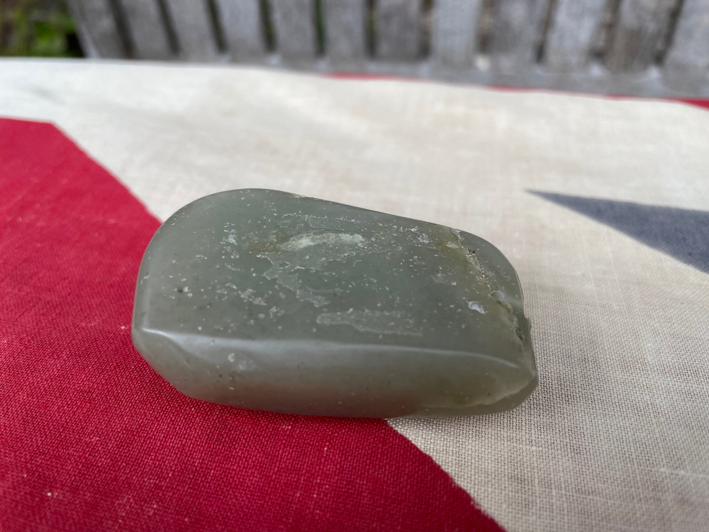 A Chinese Green Jade Pebble Hand Carved in Relief With a Dragon 6cm Wide