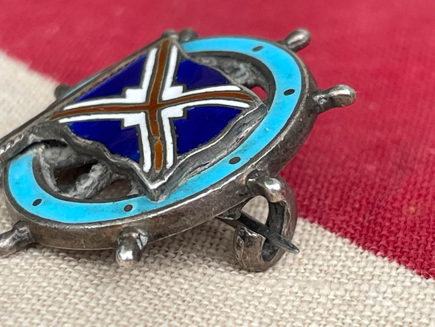 A Solid Silver and Enamel Pin Badge -Union-Castle Shipping Line Ships Wheel Badge Made in Southall,  Birmingham 1909 by Michael Emanuel