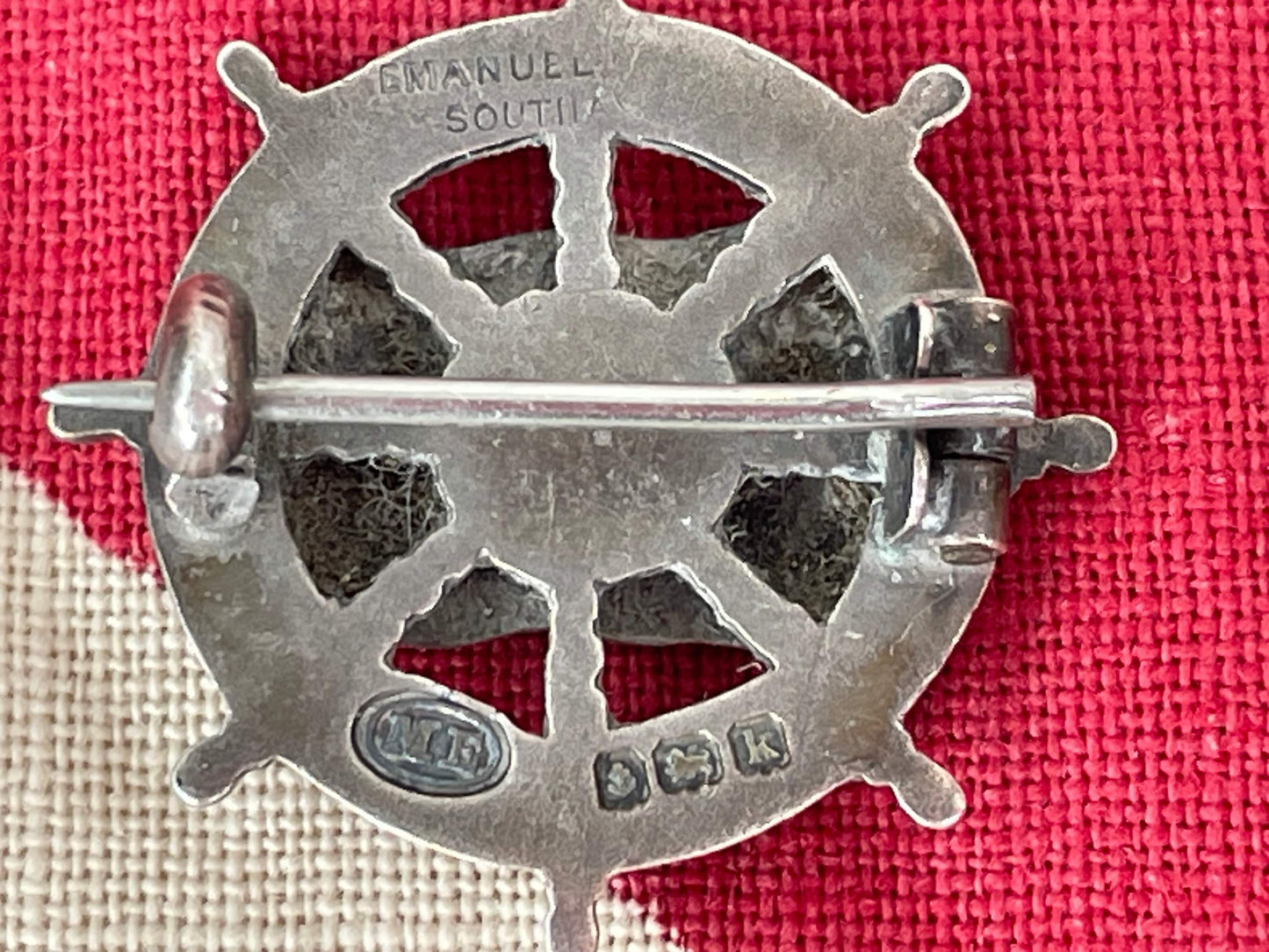 A Solid Silver and Enamel Pin Badge -Union-Castle Shipping Line Ships Wheel Badge Made in Southall,  Birmingham 1909 by Michael Emanuel