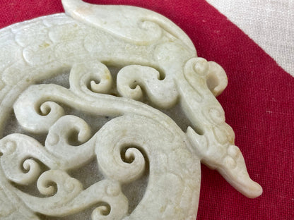 A Chinese Hardstone Disc Carving of a Curled up Dragon 8cm Diameter.