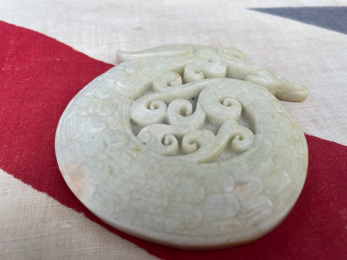 A Chinese Hardstone Disc Carving of a Curled up Dragon 8cm Diameter.