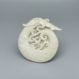A Chinese Hardstone Disc Carving of a Curled up Dragon 8cm Diameter.