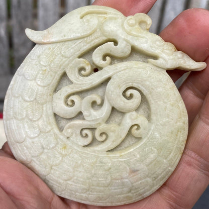 A Chinese Hardstone Disc Carving of a Curled up Dragon 8cm Diameter.