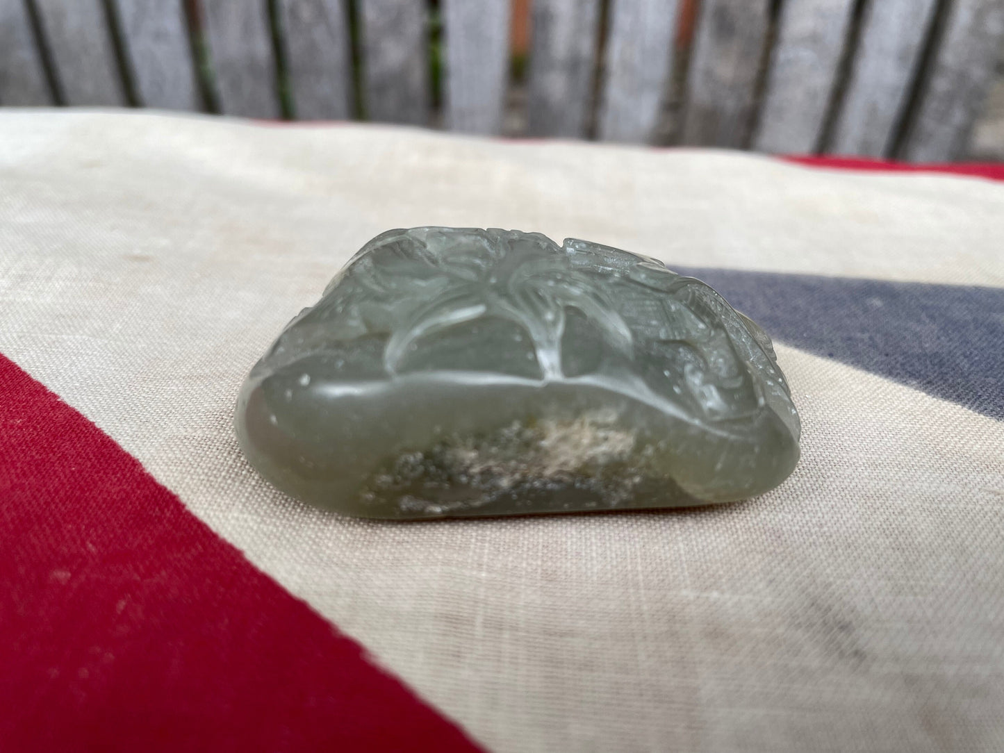 A Chinese Green Jade Pebble Hand Carved in Relief With a Dragon 6cm Wide