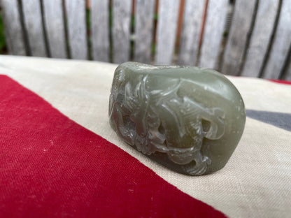 A Chinese Green Jade Pebble Hand Carved in Relief With a Dragon 6cm Wide