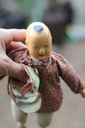 Vintage Chinese carved wood doll with amulet coin – 23cm straw-stuffed cloth body, painted face, cap & jacket c.1930s–50s