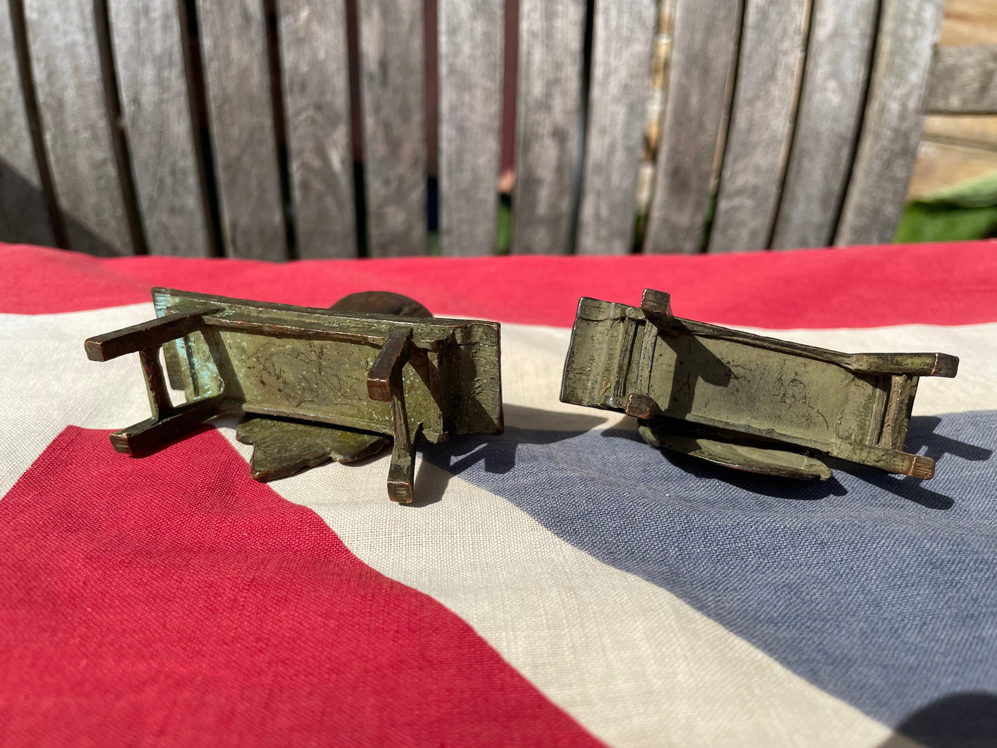 A Close Pair of Chinese Patinated Copper Bronze Figures of Scholars on Benches, the Largest 7.5cm Wide