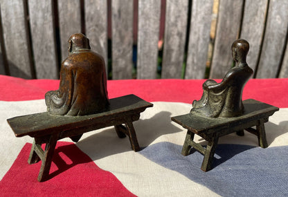 A Close Pair of Chinese Patinated Copper Bronze Figures of Scholars on Benches, the Largest 7.5cm Wide