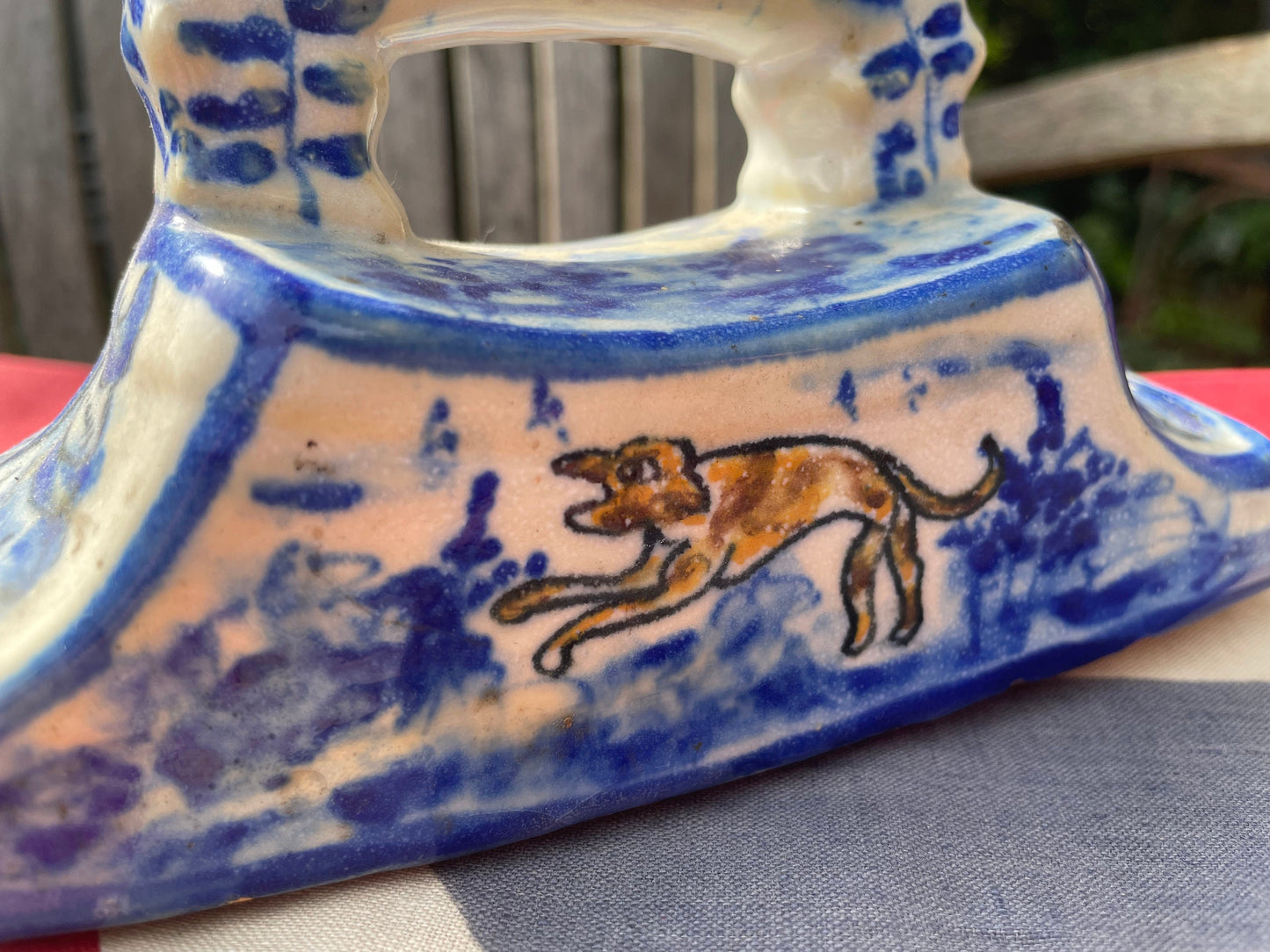 An 18th Century Dutch Delft Pottery Desk Blotter With Polychrome Design of a Dog, Length 17cm