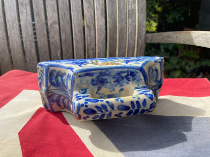 An 18th Century Dutch Delft Pottery Desk Blotter With Polychrome Design of a Dog, Length 17cm