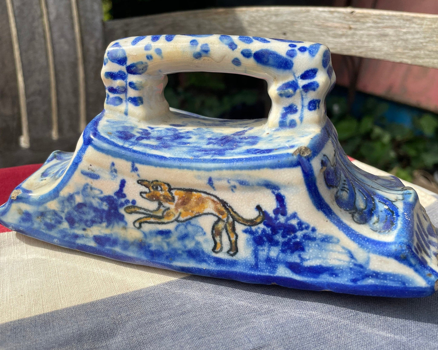 An 18th Century Dutch Delft Pottery Desk Blotter With Polychrome Design of a Dog, Length 17cm