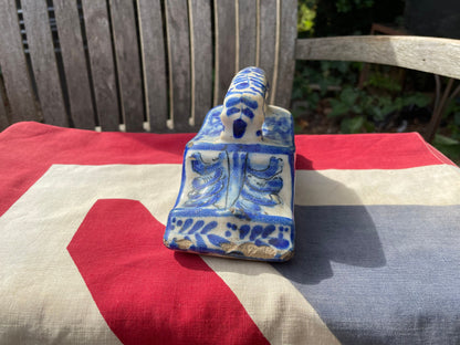 An 18th Century Dutch Delft Pottery Desk Blotter With Polychrome Design of a Dog, Length 17cm