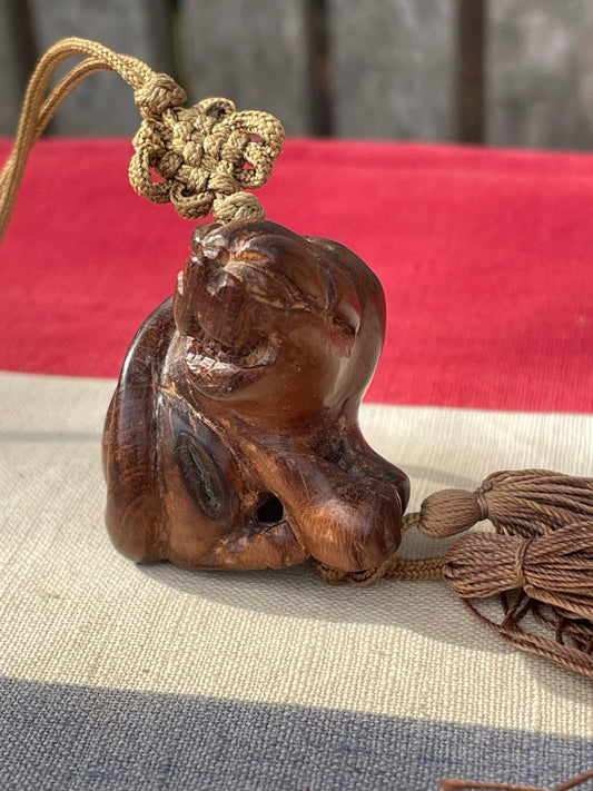 A Hand Carved Hard Wood Dress Toggle of a Chinese Foo Dog on a Silk Cord 4cm Long