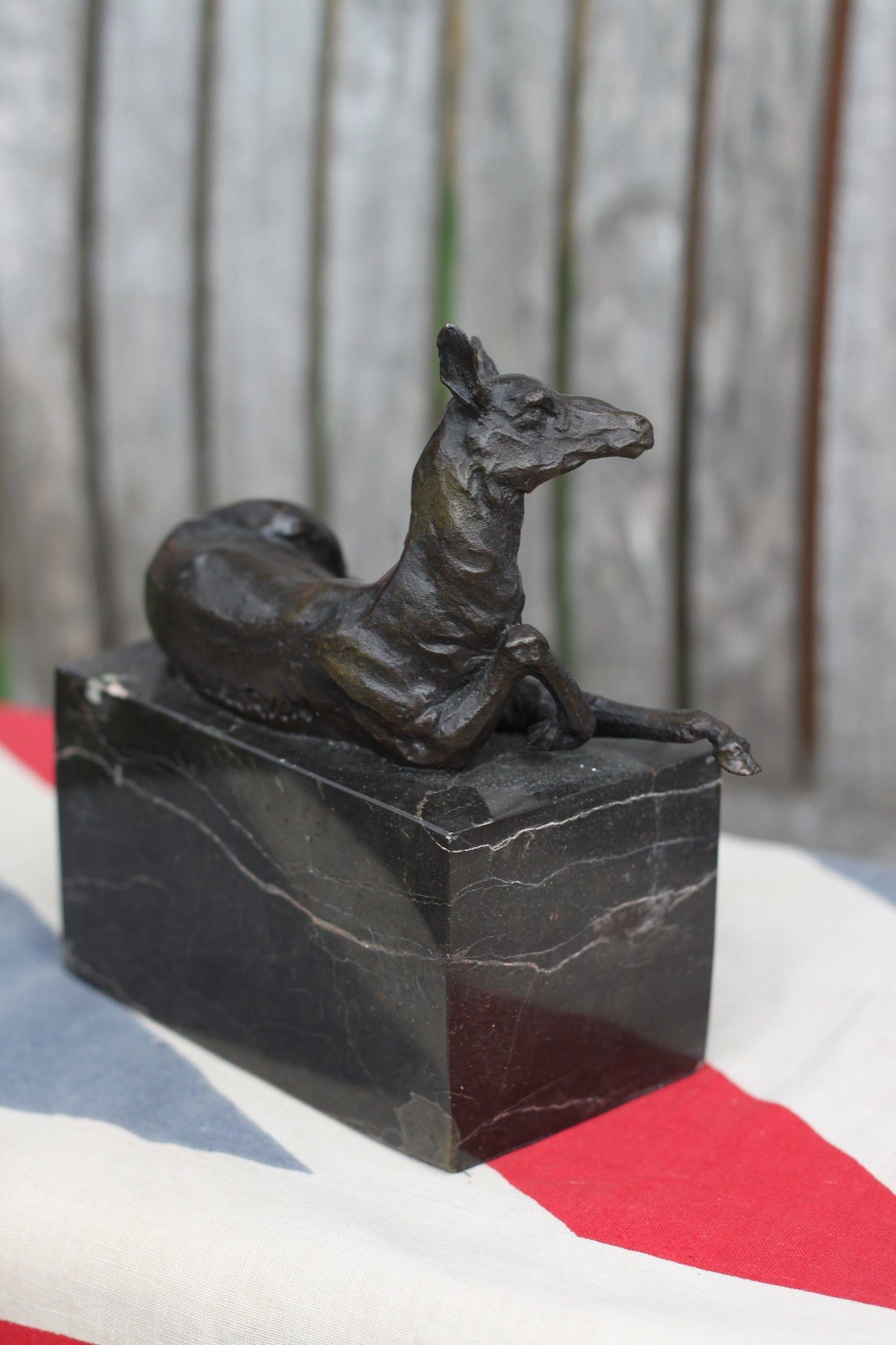 A  Patinated Bronze Study of a Recumbent Llama/Deer on a Black Marble Base Signed  L. Carvin, , 14cm in Length 1.98kg