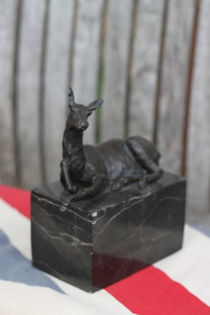 A  Patinated Bronze Study of a Recumbent Llama/Deer on a Black Marble Base Signed  L. Carvin, , 14cm in Length 1.98kg