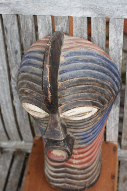 A Songye Kifwebe style African wooden wall mask - partially painted- hand carved , 37cm high