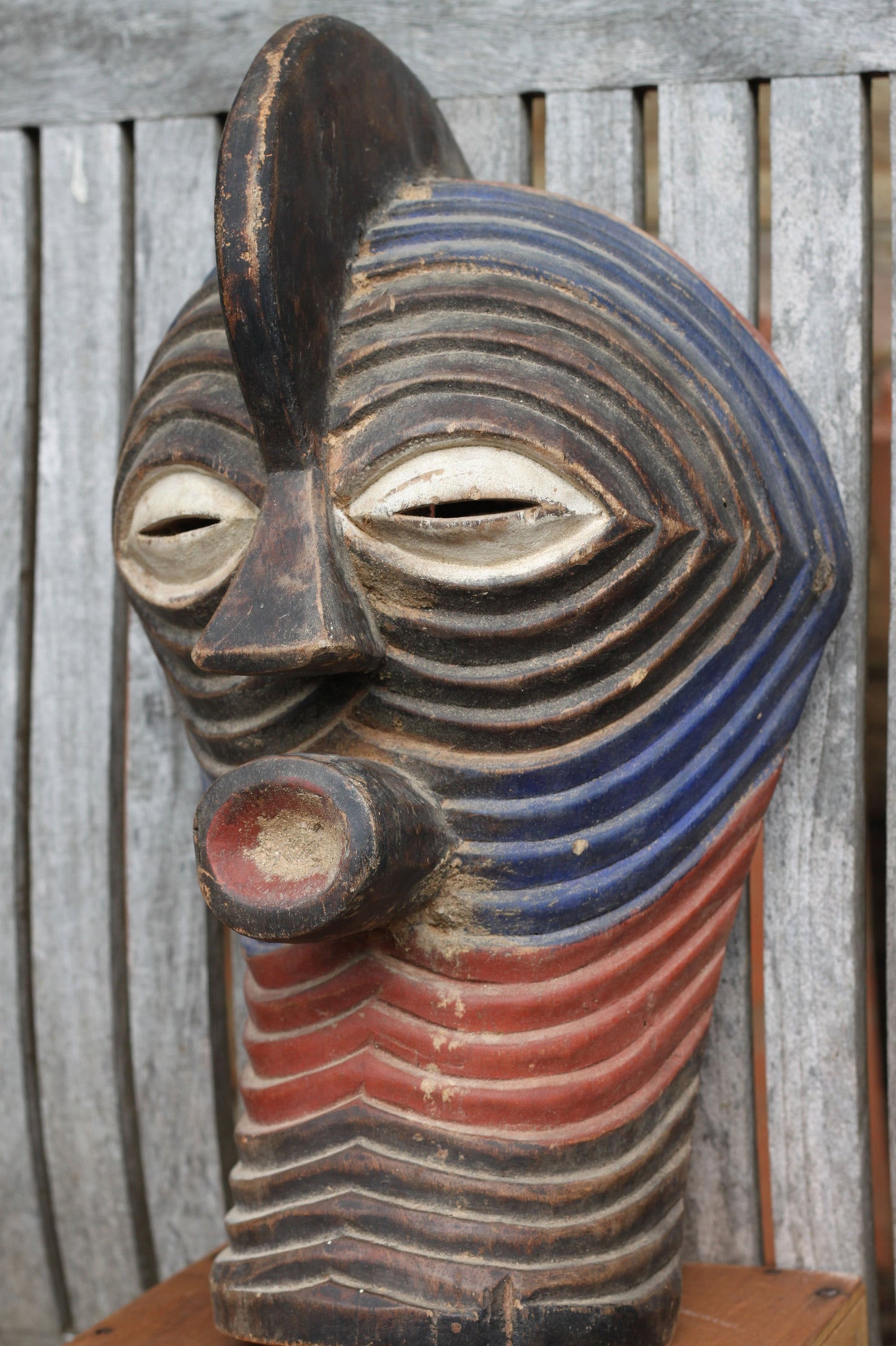 A Songye Kifwebe style African wooden wall mask - partially painted- hand carved , 37cm high