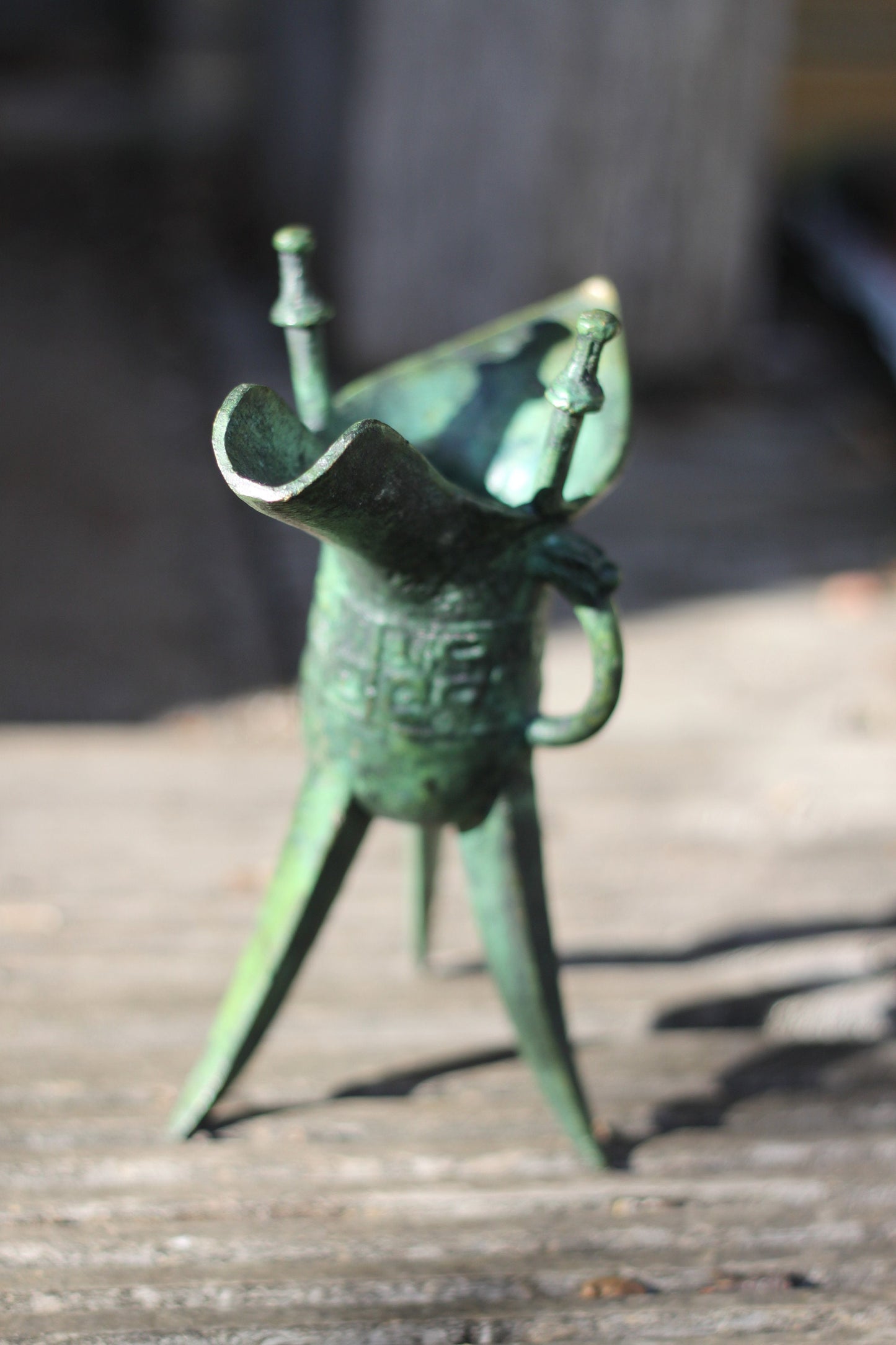 A Chinese Bronze Archaistic Tripod Jue Cup (ex. Late Prof. R.M. Hicks OBE), 18cm Tall