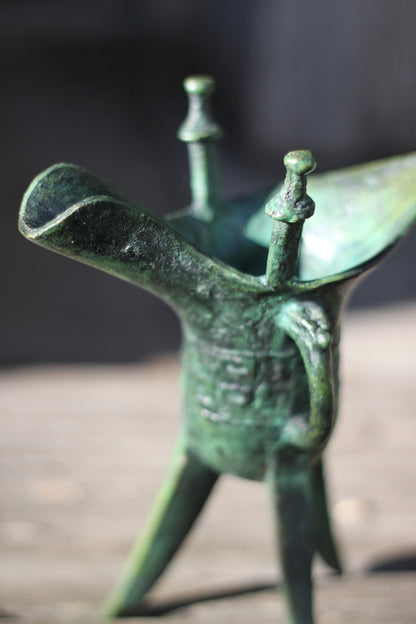 A Chinese Bronze Archaistic Tripod Jue Cup (ex. Late Prof. R.M. Hicks OBE), 18cm Tall