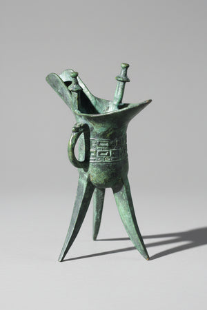 A Chinese Bronze Archaistic Tripod Jue Cup (ex. Late Prof. R.M. Hicks OBE), 18cm Tall