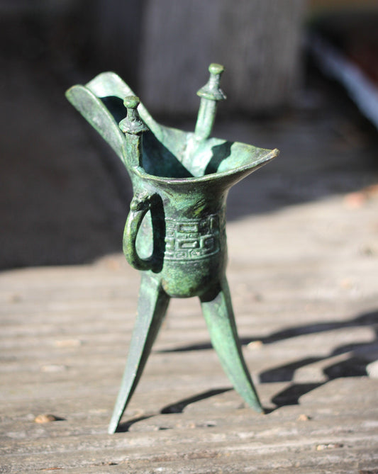 A Chinese Bronze Archaistic Tripod Jue Cup (ex. Late Prof. R.M. Hicks OBE), 18cm Tall