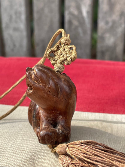 A Hand Carved Hard Wood Dress Toggle of a Chinese Foo Dog on a Silk Cord 4cm Long