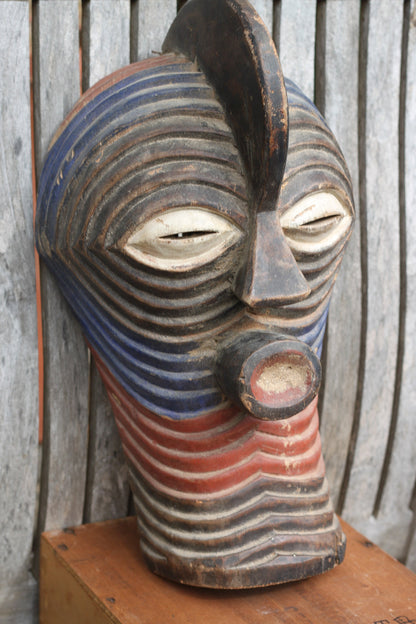 A Songye Kifwebe style African wooden wall mask - partially painted- hand carved , 37cm high