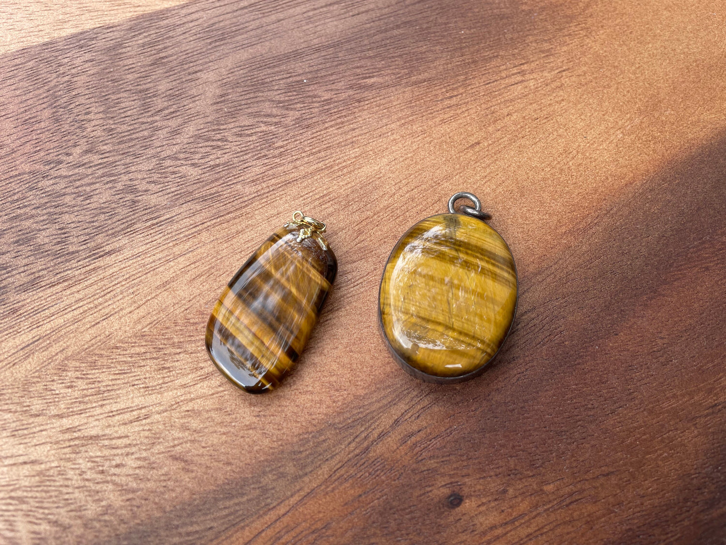 A Couple of Tiger's Eye Drop Pendants Larger With Silver Mount and 4cm Tall