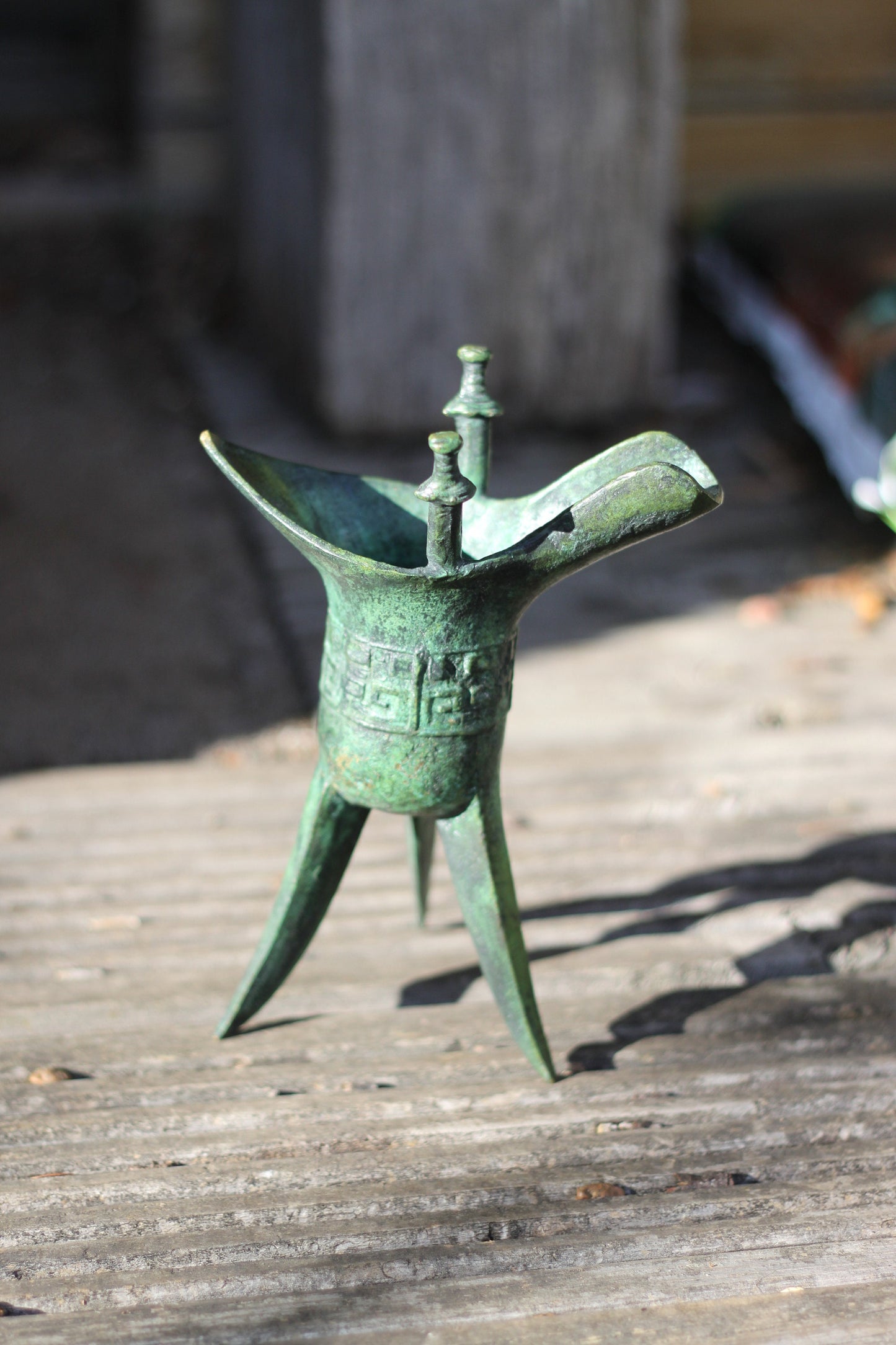 A Chinese Bronze Archaistic Tripod Jue Cup (ex. Late Prof. R.M. Hicks OBE), 18cm Tall