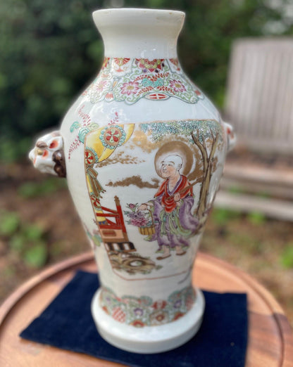 A Large Chinese Late 19th Century White Glaze Porcelain Vase With Hand Painted Figures, Bands of Blossom and Dog of Fo Handles, Height 37cm