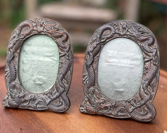 A Pair of Antique Oriental Chinese Oval Antimony Easel Back Picture Frames With Entwining Dragons H12cm