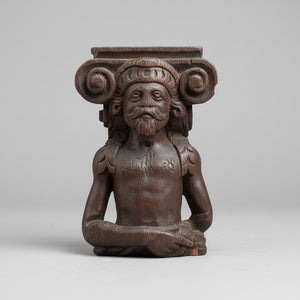 A 17th Century Carved Oak Figural Folk Art Corbel Depicting a Bearded Man 16cm Tall