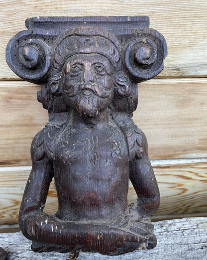 A 17th Century Carved Oak Figural Folk Art Corbel Depicting a Bearded Man 16cm Tall