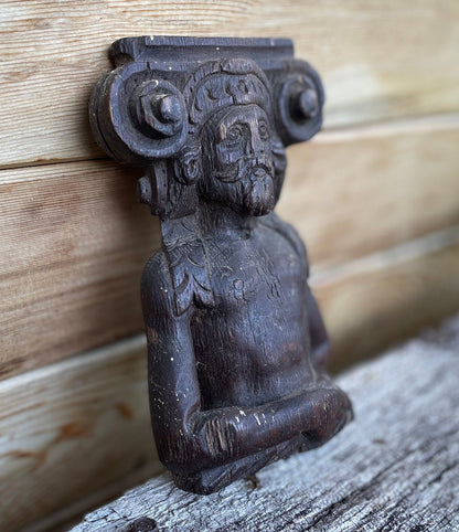 A 17th Century Carved Oak Figural Folk Art Corbel Depicting a Bearded Man 16cm Tall