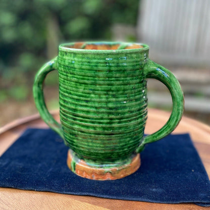 A 19th Century Green Glazed Two Handled Loving Cup by Edwin Beer Fishley for Fremington Pottery Devon (1832 - 1911)  15.5cm Tall