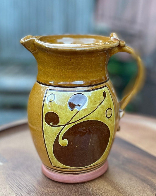 An Earthenware Jug With Slip Decoration, Makers Mark to Base Attributed to Norah Braden (1901-2001) Height 17cm