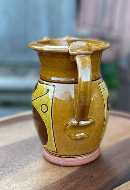 An Earthenware Jug With Slip Decoration, Makers Mark to Base Attributed to Norah Braden (1901-2001) Height 17cm