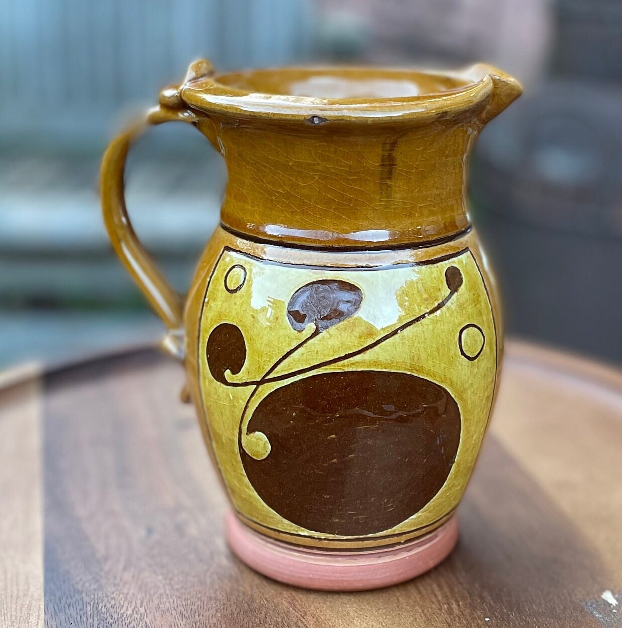 An Earthenware Jug With Slip Decoration, Makers Mark to Base Attributed to Norah Braden (1901-2001) Height 17cm