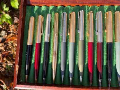 A Fine Collection of Parker Propelling/Clutch Pencils and Ball Points in a Hard Wood Presentation Case